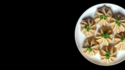 A plate with a delicious dish rotates on a black background. Stylish footage for culinary projects. Can be used for commercials and more. - Powered by Adobe