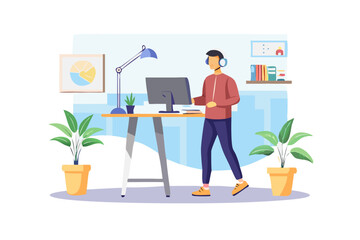 Man working at standing desk with headset in modern office