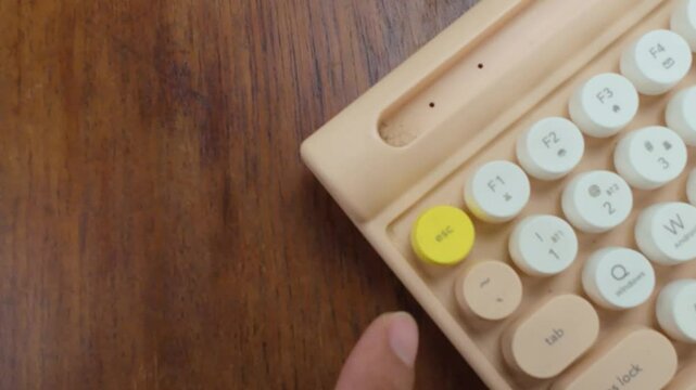 Retro Keyboard Close Up on Wooden Desk Surface