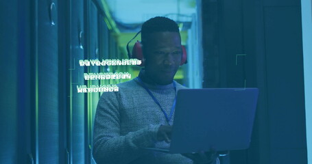 IT technician wearing sweater, red earmuffs analyzing laptop in data center, floating code overlay