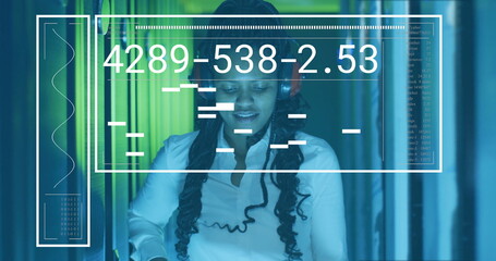 Woman wearing white shirt, headphones monitoring server racks with interface overlay at data center