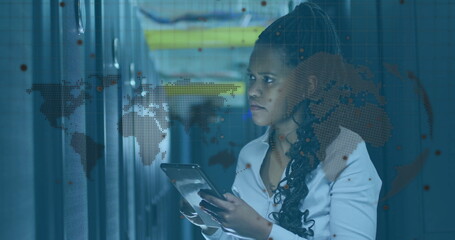 Engineer in shirt reviewing logs on tablet in server rack aisle, world map overlay, copy space