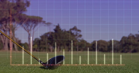 Displaying golf driver head and shaft resting on trimmed grass at tee box, with chart overlay