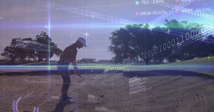 Swinging golfer in sportswear striking ball with club in golf course bunker, with digital overlays