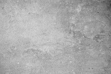 Light gray concrete wall surface with subtle scratches and textured background