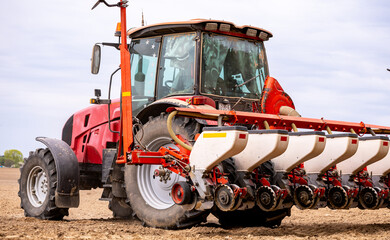Precision inline seeder. A row seeder. Seed drill. Tractor with mounted seeder performing direct...