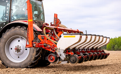 Precision inline seeder. A row seeder. Seed drill. Tractor with mounted seeder performing direct...