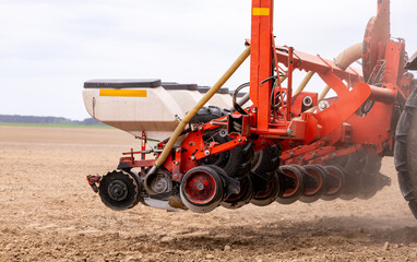 Precision inline seeder. A row seeder. Seed drill. Tractor with mounted seeder performing direct...