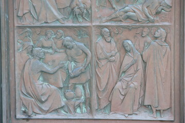Reliefs on the bronze entrance door of the Duomo di Siena, Italy