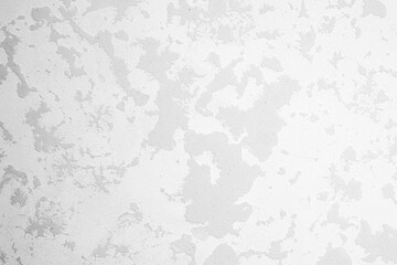 Abstract texture of light gray surface with varied patterns and shades