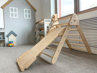Wooden Climbing Frame with Slide in a Playroom