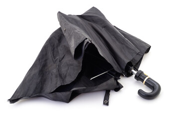 Broken black umbrella isolated.