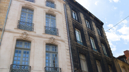 Industrial renovation cleaning building facade contrast before and after major clean and washing of house wall with high pressure water in the city exterior