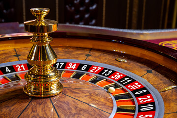 Roulette wheel. Casino. Gambling game. Roulette wheel on table in a casino. Roulette. The game in...