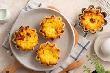 Delicious puff pastry Portuguese egg tart Pastel de nata in flower shape.