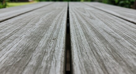 Weathered Wooden Tabletop: A Close-Up Perspective of Grayed Planks