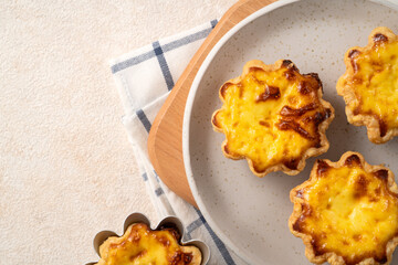 Delicious puff pastry Portuguese egg tart Pastel de nata in flower shape.