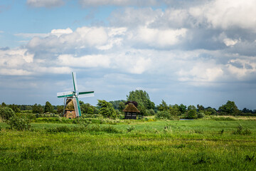 Windmill in rural landscape, Bedekaspel, Grosses Meer, Suedbrookmerland, East Frisia, Lower Saxony, Germany