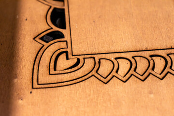 Laser engraving and cutting, using reclaimed wood, upcycling concept