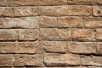 close up of brick wall texture of and historic building in Siena, Italy
