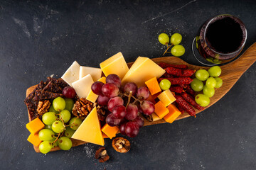 Tasty delicious cheese and appetizers board