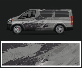 Van with Abstract Camouflage Wrap Design on a Dark Background © MdAbdullah