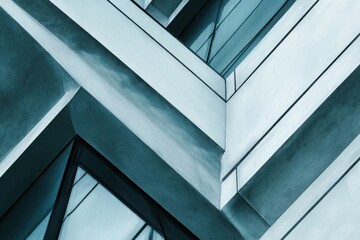 Obraz premium Abstract architecture, close-up of a building's exterior wall, sharp edges, geometric shapes, high-contrast lighting, cool tones, sharp shadows, architectural photography, modern cityscape background.