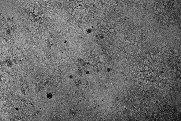 Grunge concrete wall in black and white with aged texture and spots