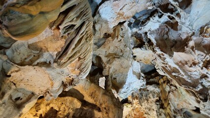 Stunning rock formations inside Thien Cung Cave in Ha Long Bay, Vietnam, showcasing majestic...