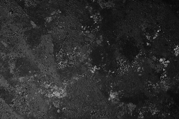 Black cracked textured surface with grunge abstract pattern