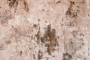 Textured wall surface displaying earthy tones and abstract patterns