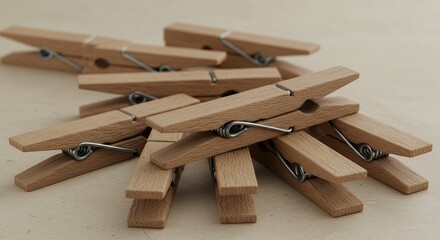 Stack of Natural Wooden Clothespins on Beige Surface