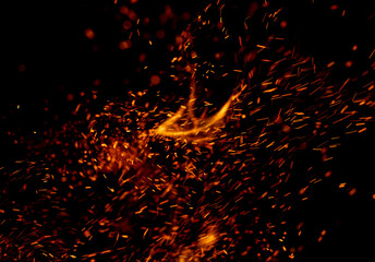 A black background with a lot of fire and smoke