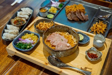 Delicious Khao Soi Northern Thai Curry Noodle Soup with Crispy Noodles and Pork