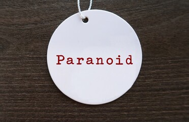 Tag with word Paranoid - mental state characterized by extreme suspicion belief that others are...