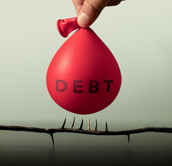 A water-filled balloon labeled “DEBT” hovers dangerously above spikes, symbolizing risk, debt crisis, financial instability and economic collapse