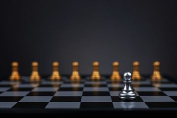 Golden Chess pawn standing to be around of other chess pawn