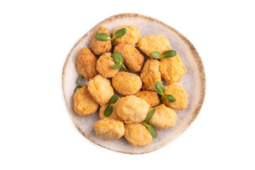 Fried crispy Chicken Nuggets with ketchup, microgreen isolated on white. top view, close up