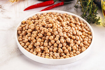 Dry chickpea seeds heap in the bowl