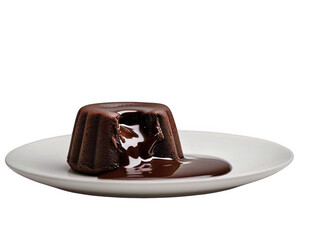 A chocolate lava cake on a white plate with melted chocolate sauce against a black background studio shot