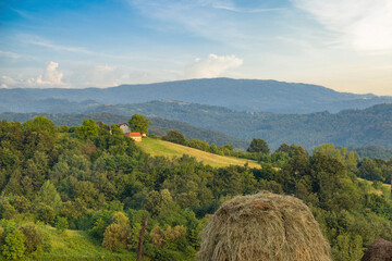 Landscape with low mountains in western Serbia. Summer evening.
