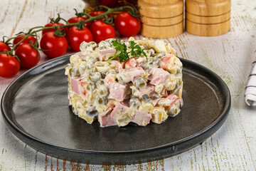 Russian traditional Olivier salad with sausages