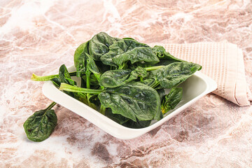 Fresh green spinach leaves heap