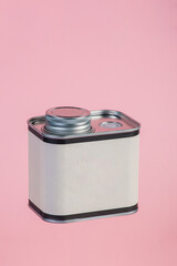 White can for packaging on pink background.