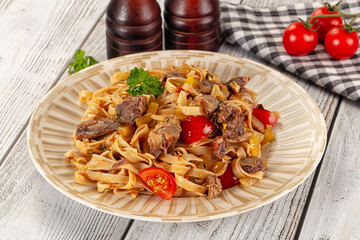 Asian udon noodles with beef
