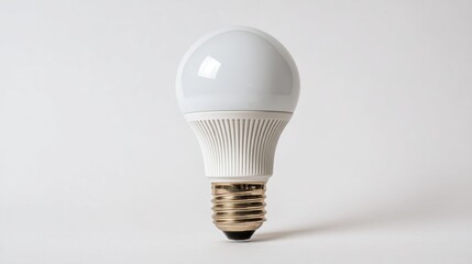 Efficient LED Bulb on Seamless White Backdrop for Energy Conservation Concepts