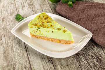 Green pistachio cheesecake served mint