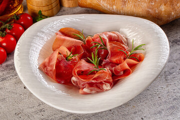 Spanish dry jamon serrano pork meat slices