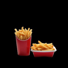 A still life of french fries in a red container and a red box on a black background in a studio shot