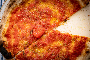 Top down view of Marinara pizza with only sauce.